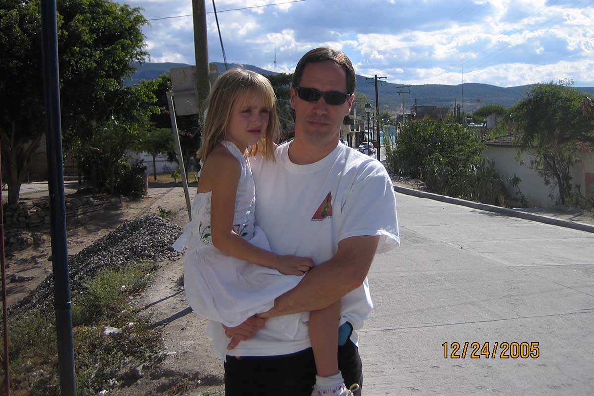 Ken carrying Amber in Mexico